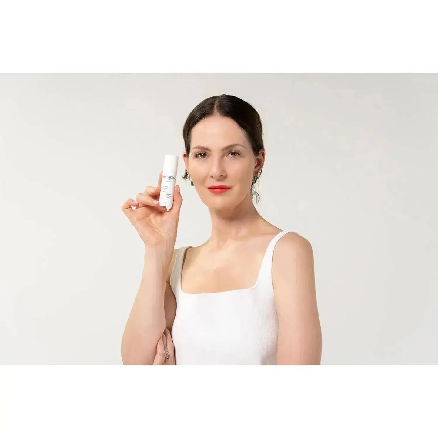 Future Advanced Line Filler - Model holding cream to her face