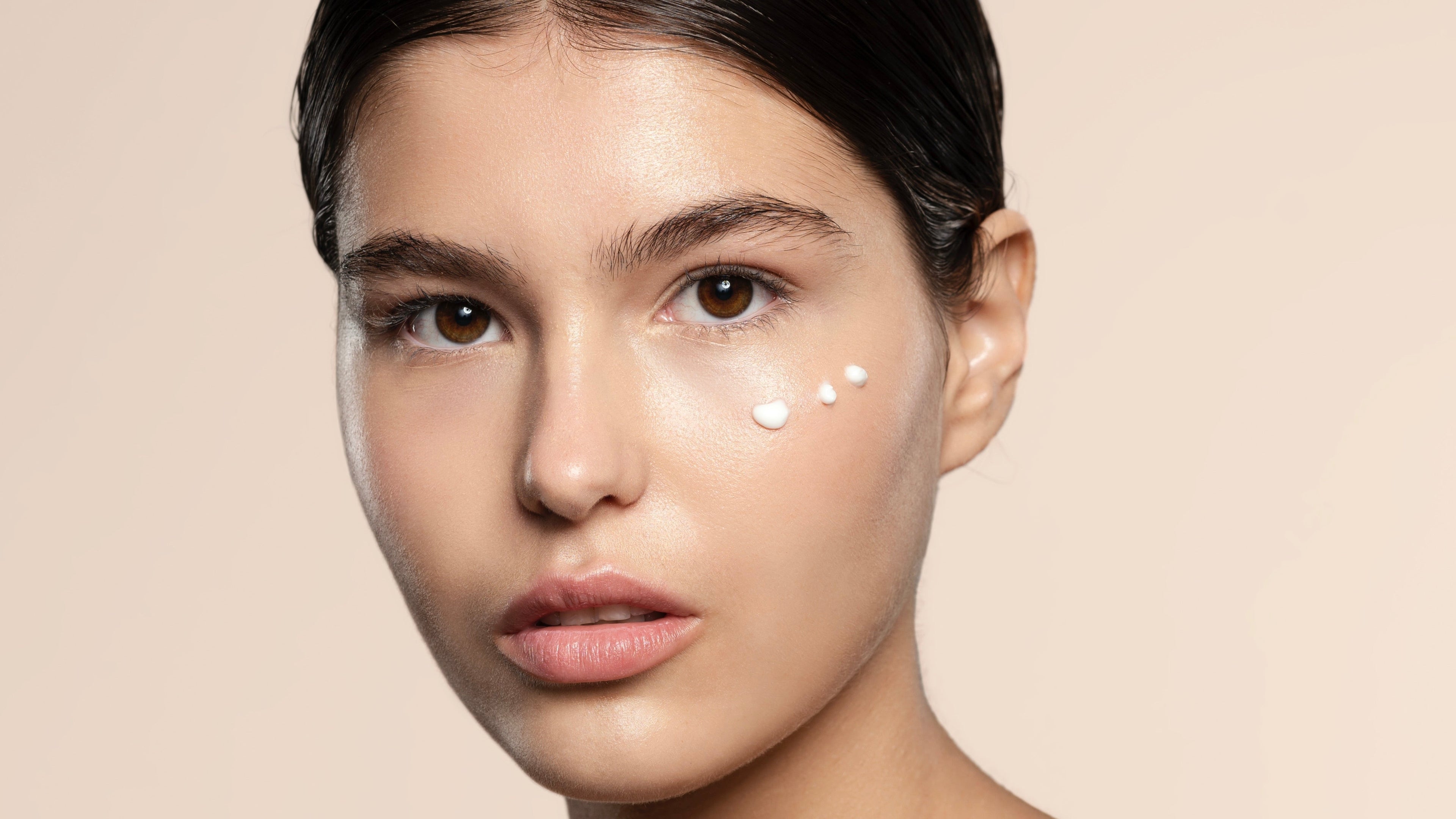 Teenage Model with skincare around her cheek