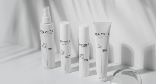 Skin Virtue Super Clear products with a glass sphere, representing a structured skincare routine for oily, combination, sensitive and blemish-prone skin.