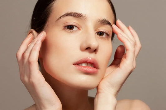 Skin Virtue model touching her face