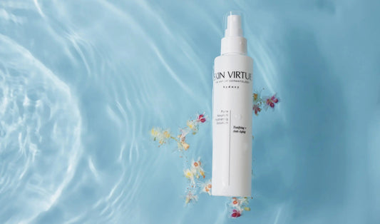 Skin Virtue Pure Nourish Hydrating Solution floating in beautiful aqua blue water.blue