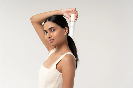 Super Clear Cleanse Model holding the product