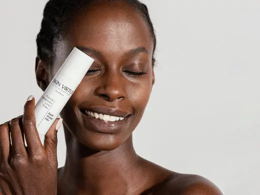 image of skin virtue model holding skin cream