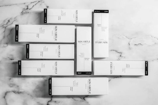 Skin Virtue Super Clear product boxes arranged on marble, representing a professional sensitive-first skincare pathway for clinics.