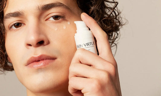 Male Model 30 years old hold Future Advanced Eye Serum applying 3 dots to his face