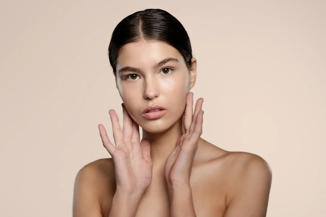Skin Virtue Model with her hands on her face looking at the camera