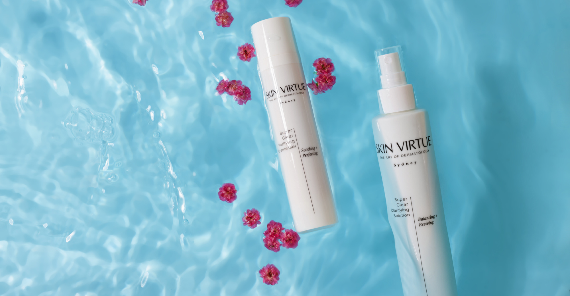 Skin Virtue Super Clear Purifying Crème Gel and Super Clear Clarifying Solution skincare bottles floating on a bright blue water surface with scattered pink flower petals.