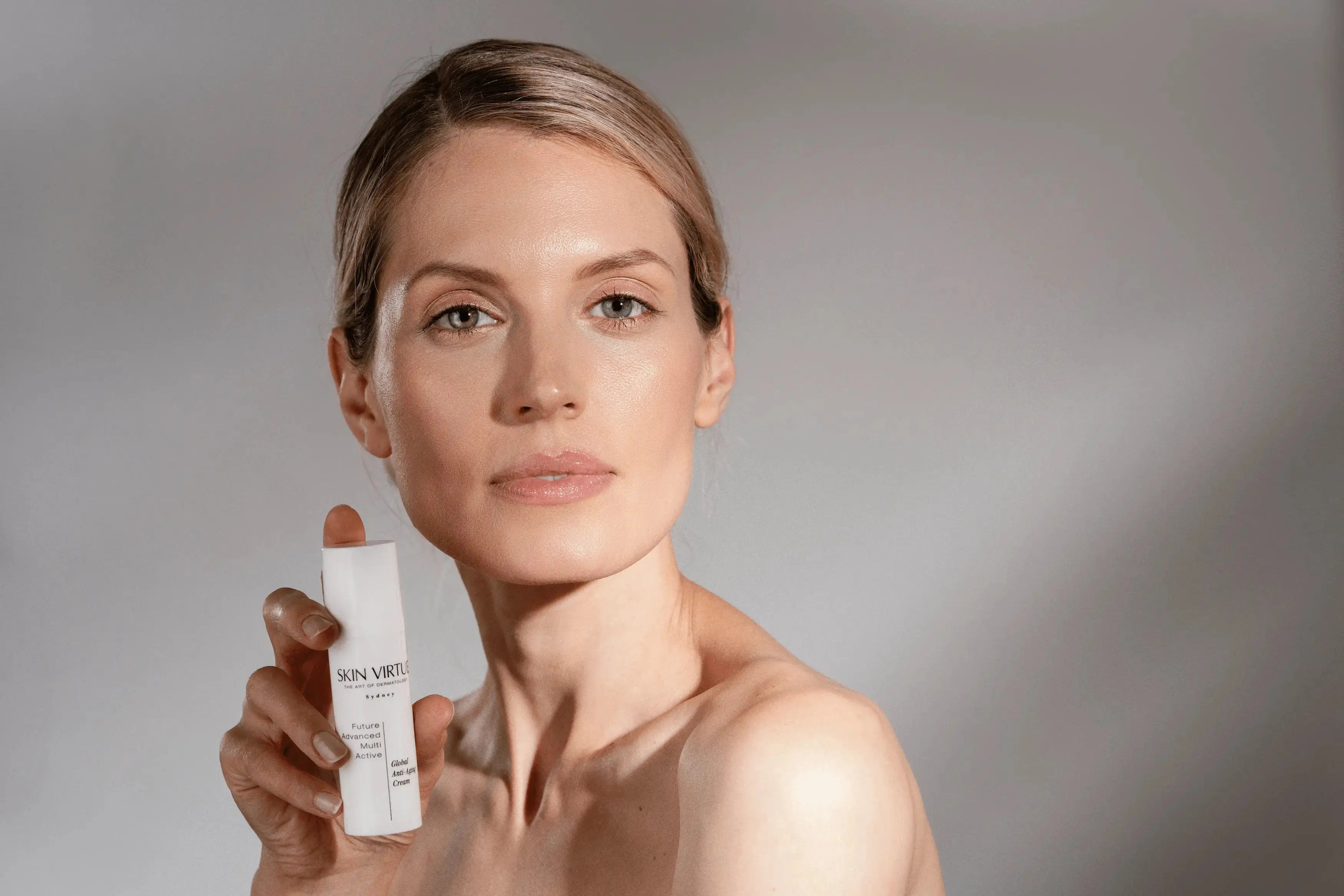 Post-Treatment Recovery & Repair model holding cream