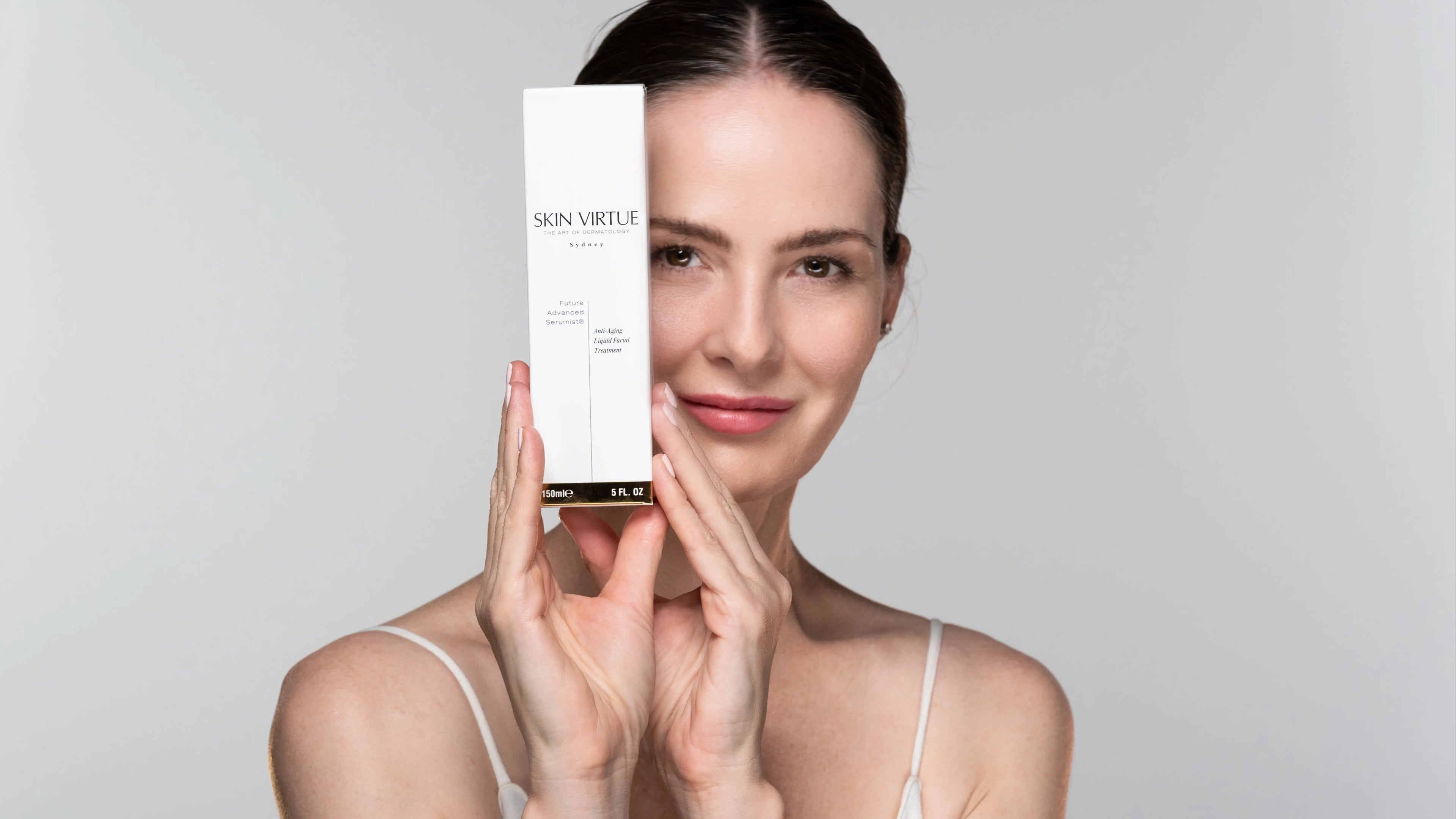 Nina holding the Future Advanced Serumist® - Skin Virtue