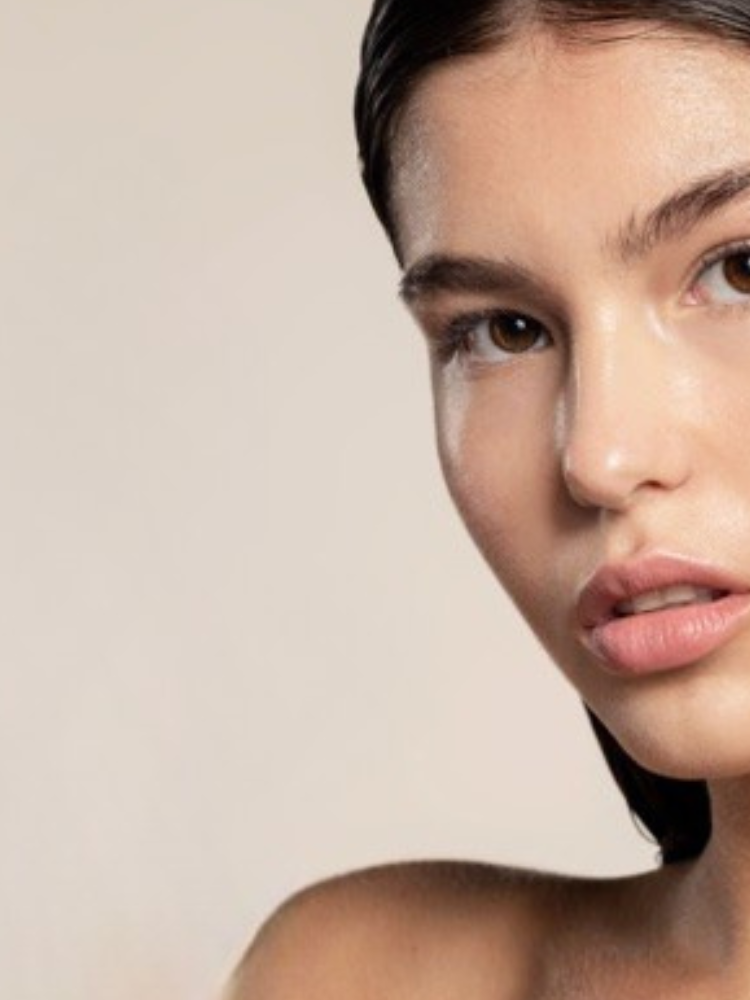 Skin Virtue Close up of 23 year old white model holding Super Clear Essential Cream 