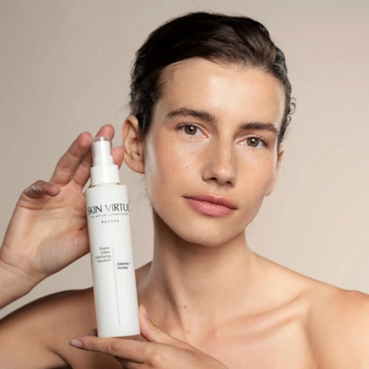 Super_Clear_Clarifying_Solution-_Skin_Virtue_-_Oily_and_Combination_Skin_-_Pore_refining-Model_holding_bottle