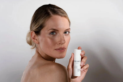 Middle aged Model holding Brightening Cream